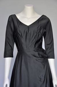 1950s black satin party dress with side bow XS - Fashionconstellate.com