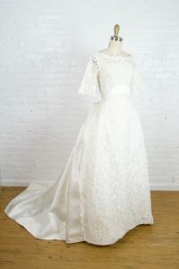 1950s beaded lace and satin wedding gown . 50s Bianchi wedding dress with bow and the train . small  - Fashionconstellate.com