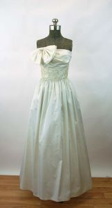 1980s gown wedding dress prom dress ivory 80s does 50s strapless dress bow on bodice pockets A J Bar - Fashionconstellate.com