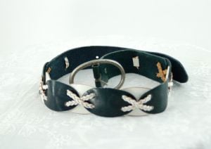 Linea Pelle leather belt with oval shapes and braided Xs dark green and white Southwestern belt