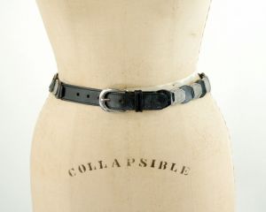 1970s leather and brass belt etched metal discs alternating with black leather links. Size S 26-29